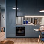 Lineárna kuchyňa v sivej v otvorenom apartmáne