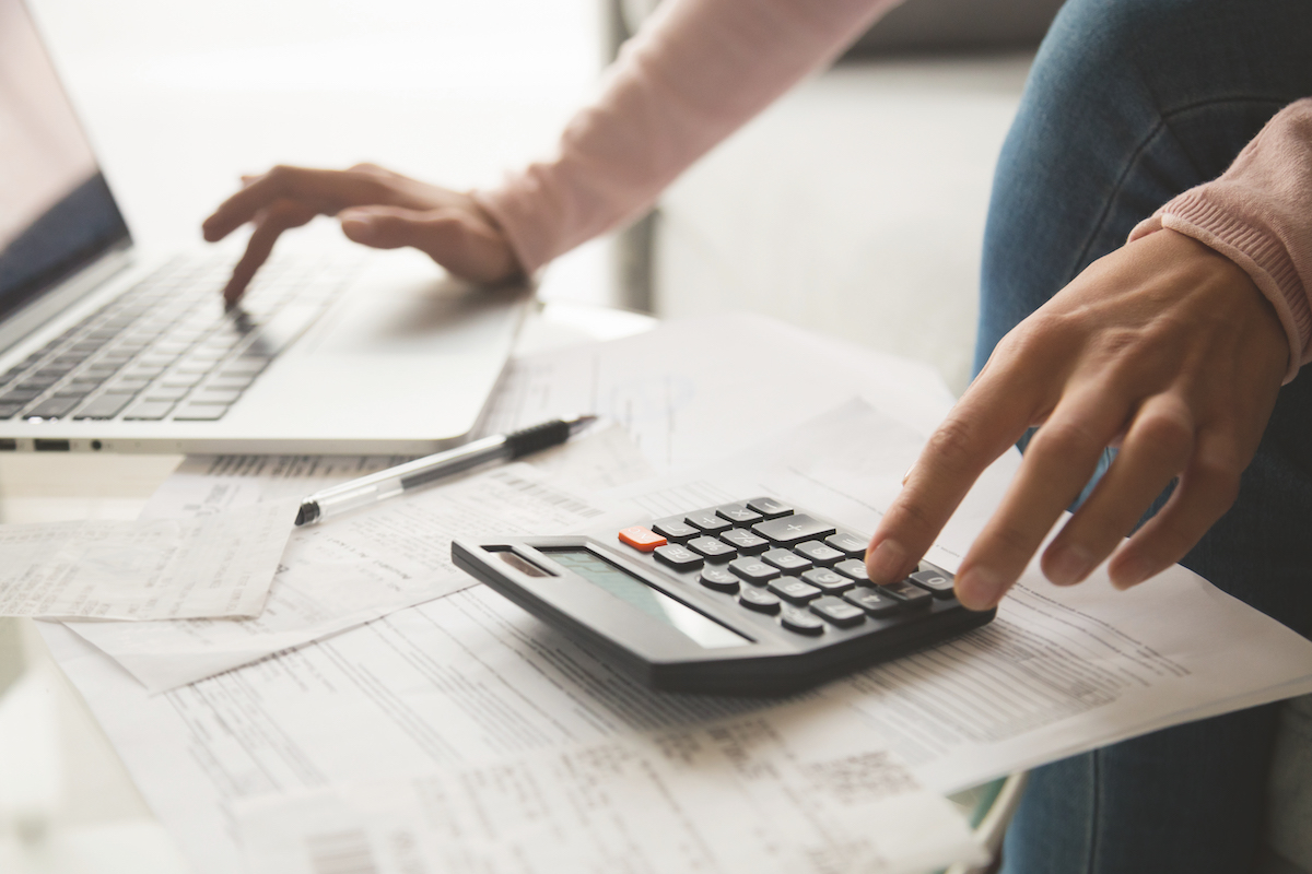 Close,Up,Cropped,Image,Young,Woman,Calculating,Monthly,Expenses,,Managing