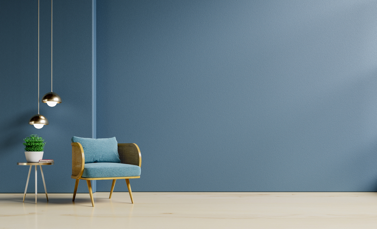 Interior design of living room with armchair on empty dark blue wall background.