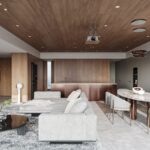 Luxusný otvorený priestor s dreveným stropom, sivou sedačkou, kuchyňou s medenými prvkami a mramorovým jedálenským stolom.