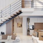 Moderná kuchyňa s jedálenským stolom a sedačkou pod schodmi na galériu.