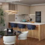 Moderná kuchyňa s minimalistickými taupe skrinkami a dreveným ostrovčekom s kamennou pracovnou doskou a modrými barovými stoličkami.